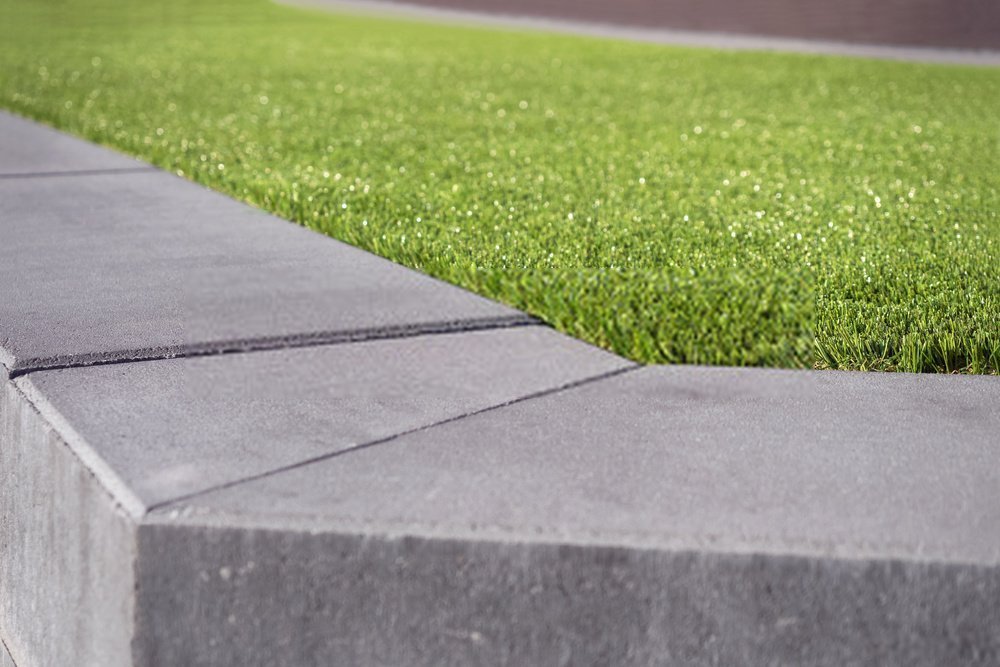 laying artificial grass on concrete